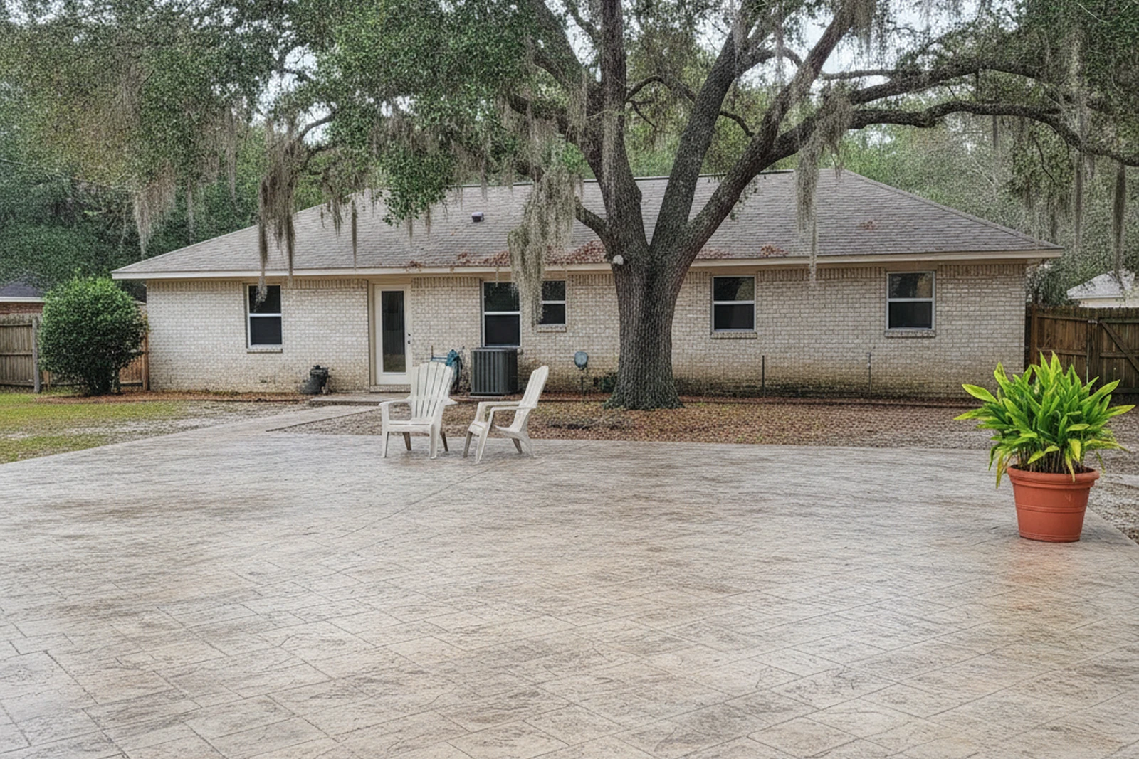 Stamped concrete patio Gautier Mississippi Jackson County Gulf Coast ashlar slate sealed UV live oaks residential